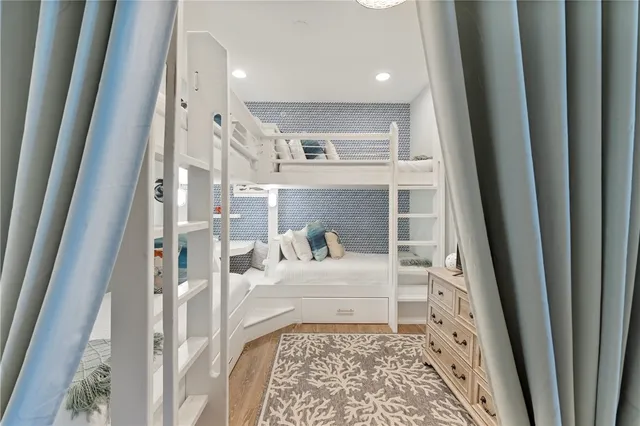 a room with a baby crib and a couch