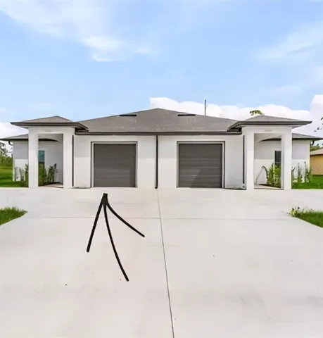 a house view with a backyard space