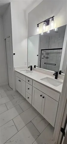 a bathroom with a sink and mirror