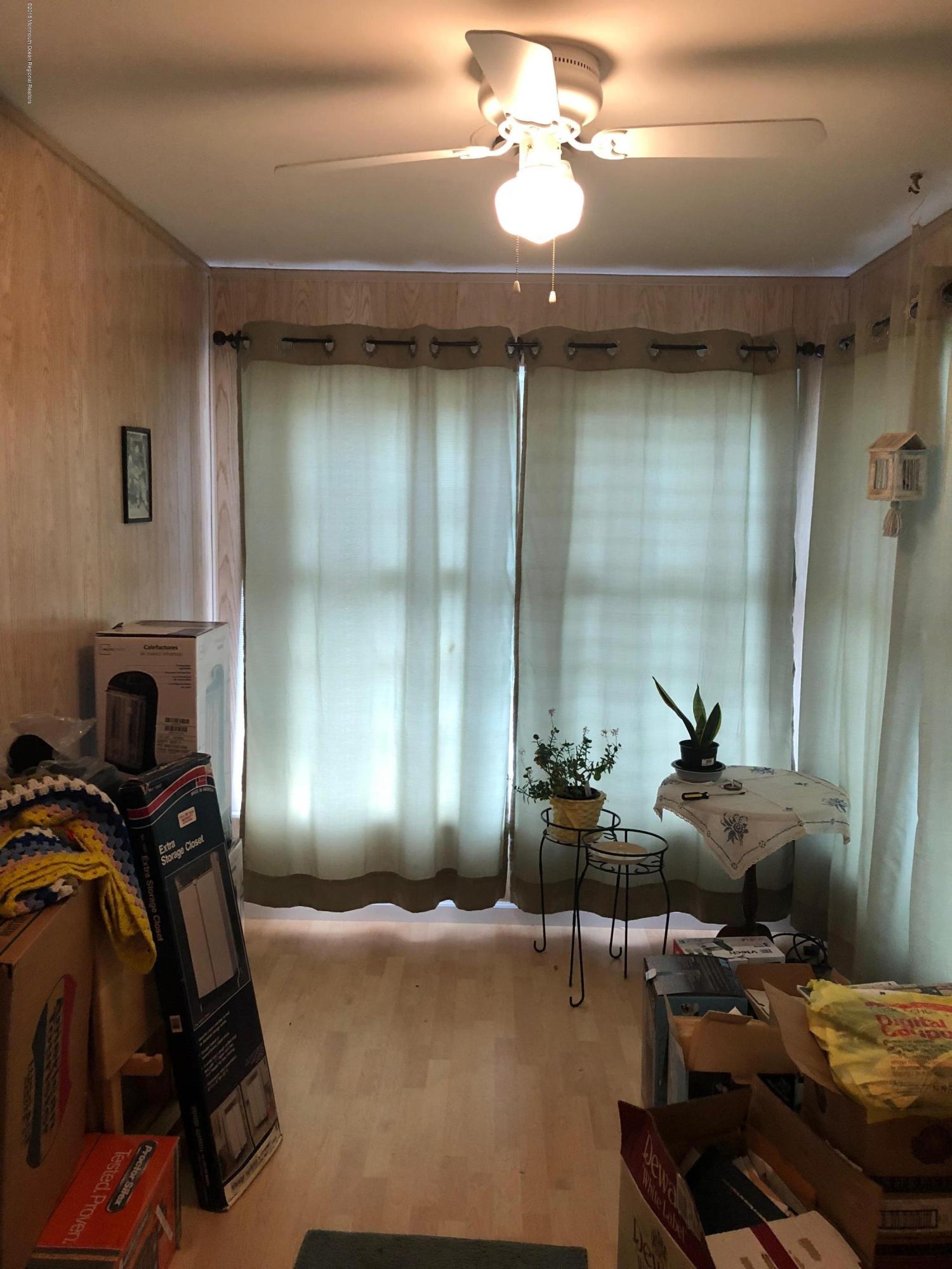 13 A Walnut Road, Unit 15B Manahawkin, NJ 08050 - Photo 3 of 8 a room with gym equipment
