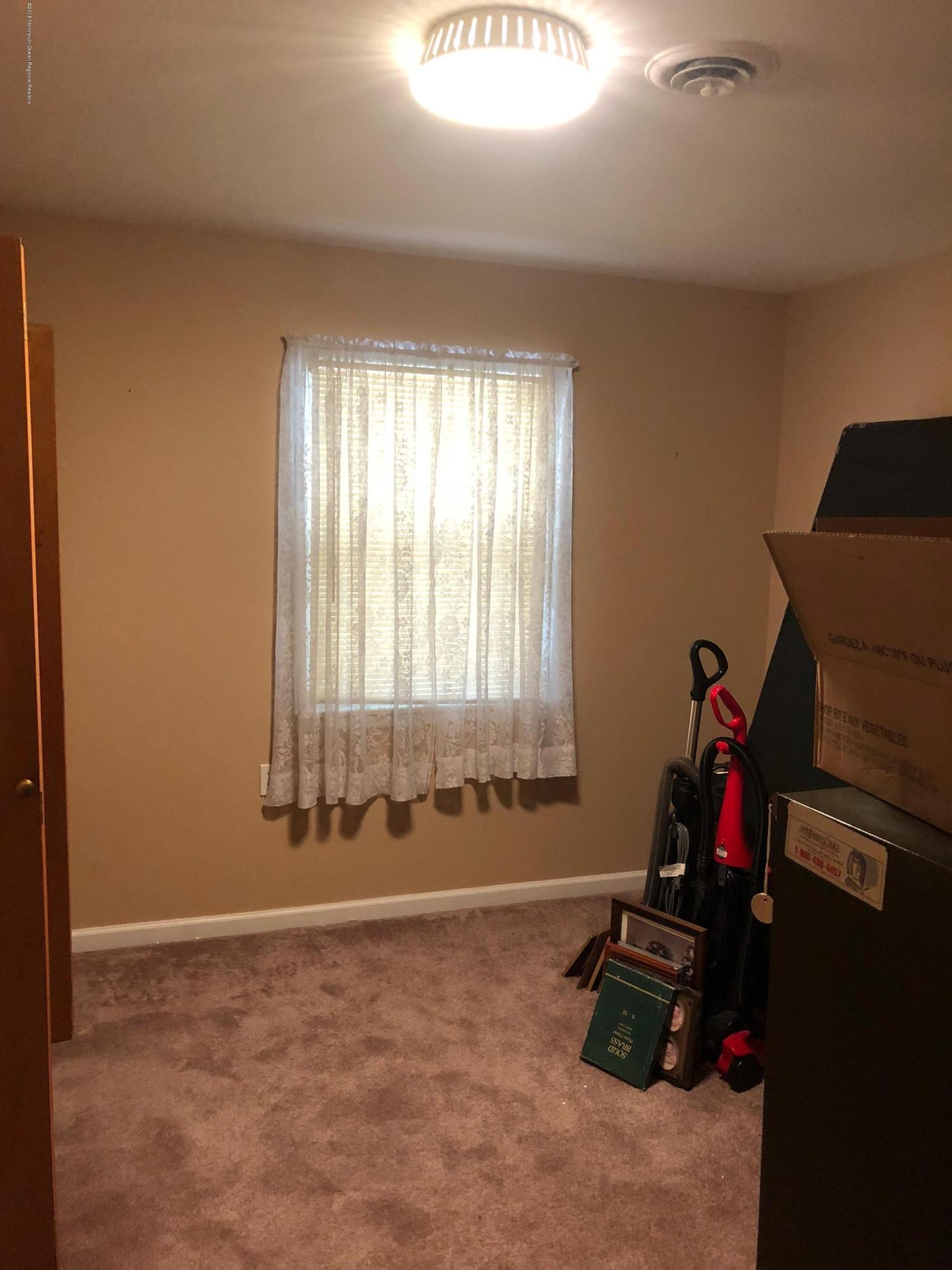13 A Walnut Road, Unit 15B Manahawkin, NJ 08050 - Photo 6 of 8 a room with gym equipment and a window
