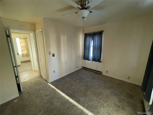 an empty room with a mirror