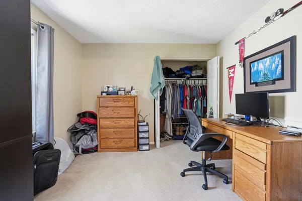 a kitchen with stainless steel appliances kitchen island granite countertop a refrigerator stove top oven and sink