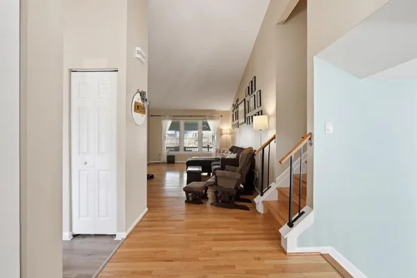 a kitchen with white cabinets and appliances