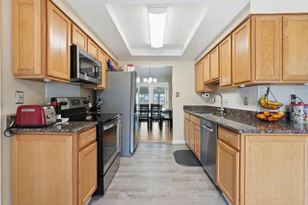 a kitchen with sink cabinets and window