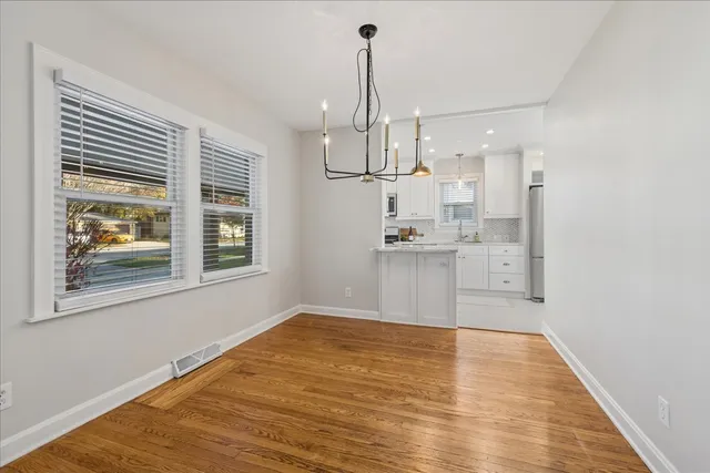 a view of kitchen with wooden floor and window