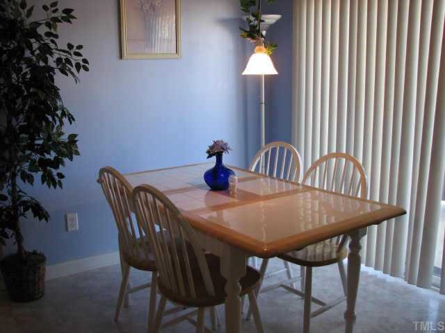 5604 Orchard Gate Way Raleigh, NC 27616 - Photo 5 of 8 a dining room with furniture and window