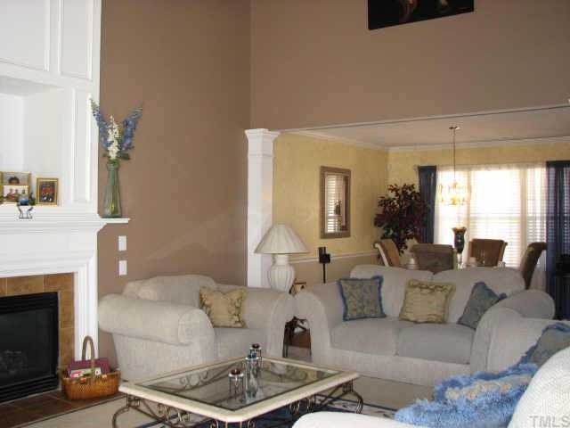 5604 Orchard Gate Way Raleigh, NC 27616 - Photo 8 of 8 a living room with furniture and a fireplace