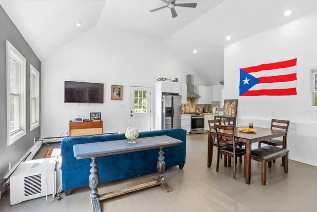 a room with furniture and a flat screen tv