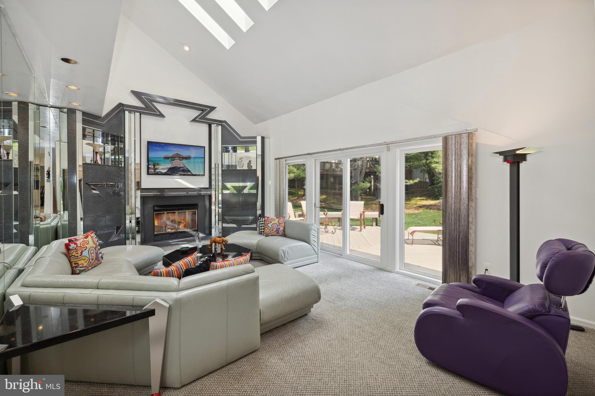 933 Willowleaf Way Potomac, MD 20854 - Photo 9 of 30 Family room has gas fireplace & door to deck