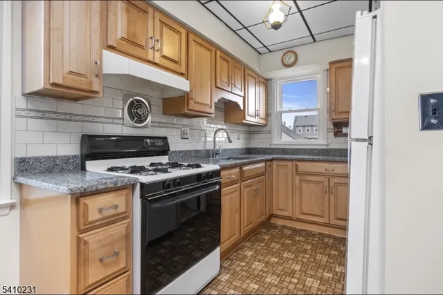 a kitchen with a stove and a sink