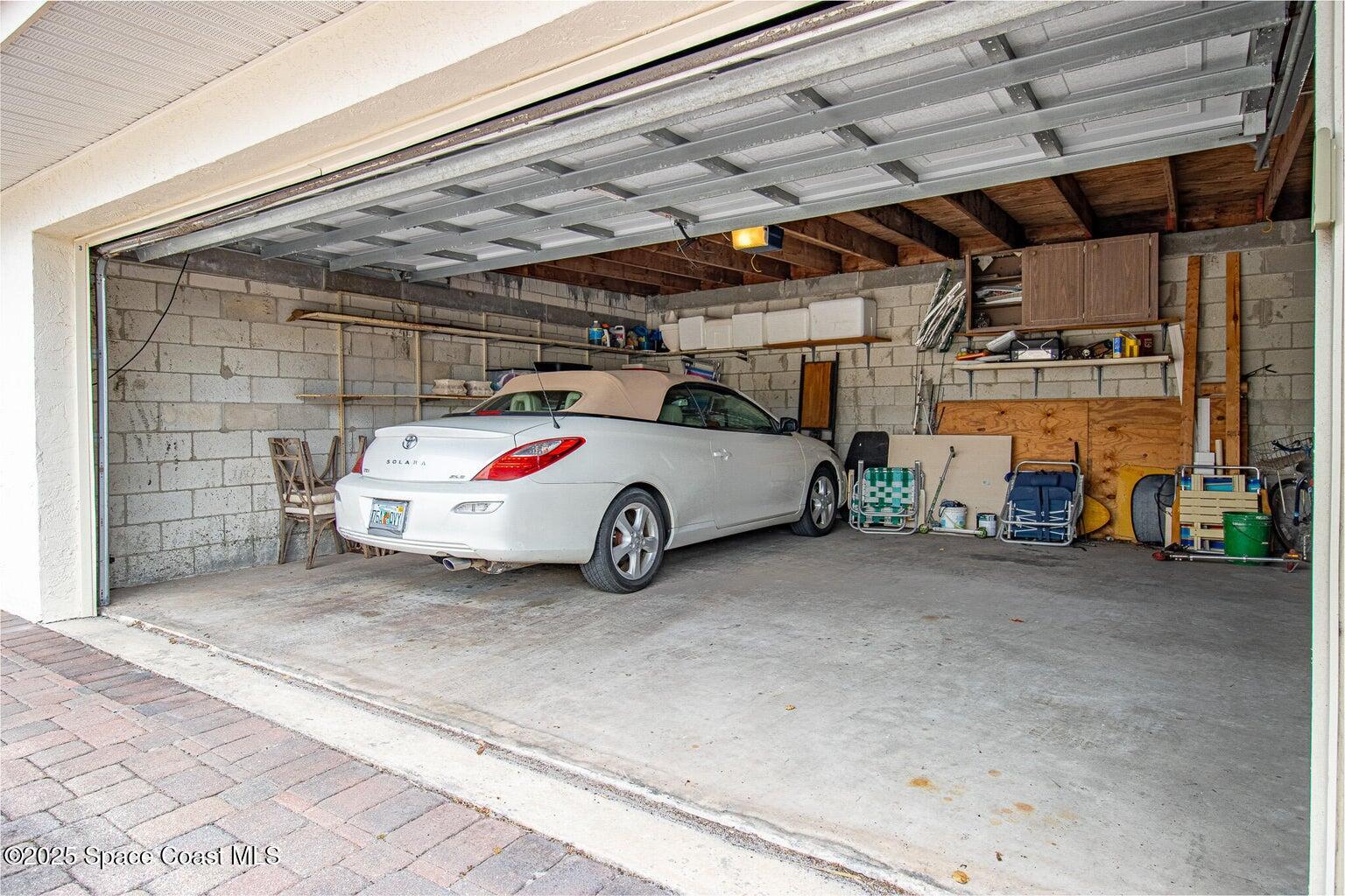 840 North Atlantic Avenue, Unit C103 Cocoa Beach, FL 32931 - Photo 23 of 30 a car parked in garage