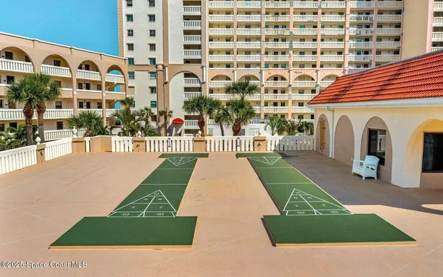 a view of a building with a yard