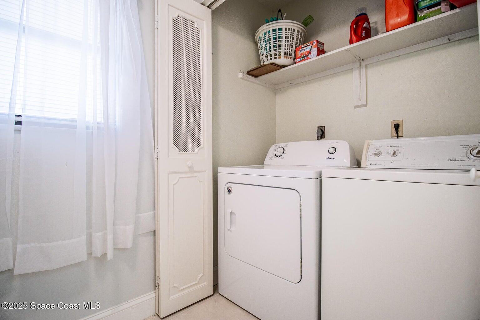 840 North Atlantic Avenue, Unit C103 Cocoa Beach, FL 32931 - Photo 5 of 30 a utility room with dryer and washer