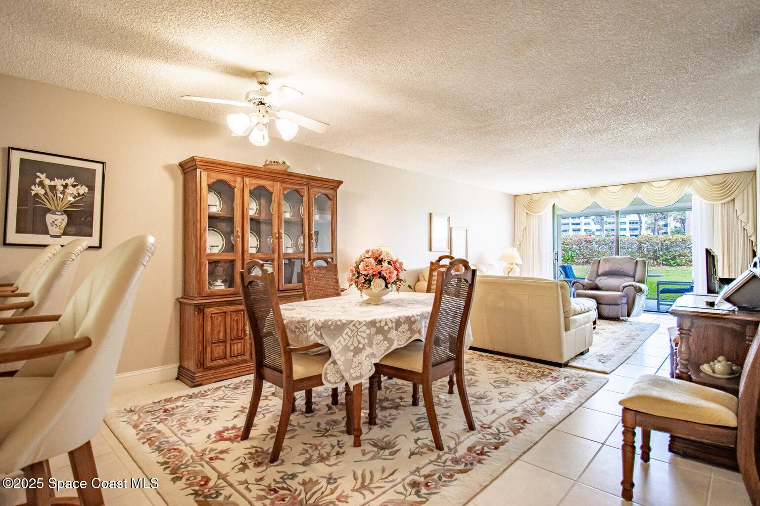 840 North Atlantic Avenue, Unit C103 Cocoa Beach, FL 32931 - Photo 7 of 30 a view of a dining room with furniture