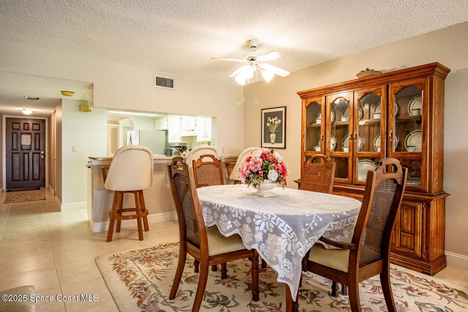 840 North Atlantic Avenue, Unit C103 Cocoa Beach, FL 32931 - Photo 8 of 30 a view of a dining room with furniture