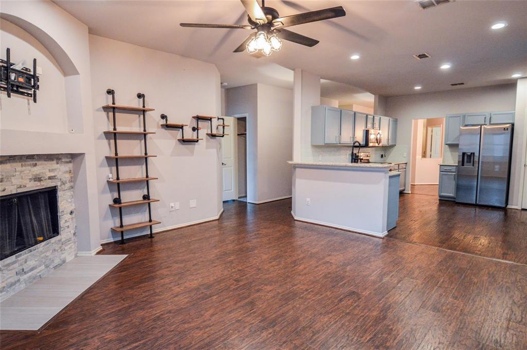 1305 Pine Ridge Road Roanoke, TX 76262 - Photo 6 of 13 a view of a kitchen with cabinets and wooden floor