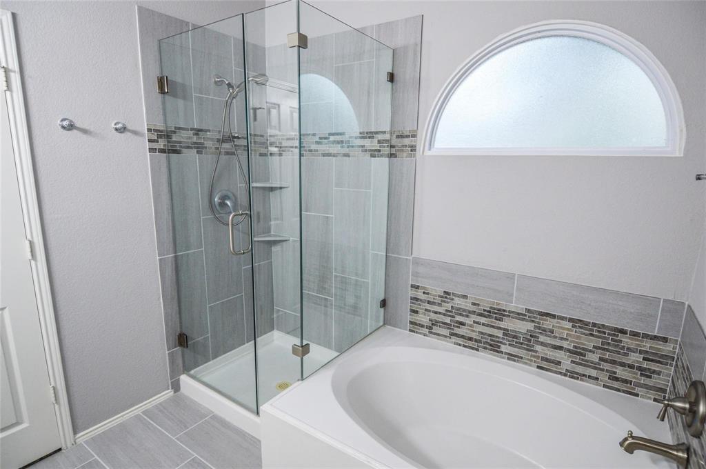 1305 Pine Ridge Road Roanoke, TX 76262 - Photo 8 of 13 a bathroom with a bathtub and a shower