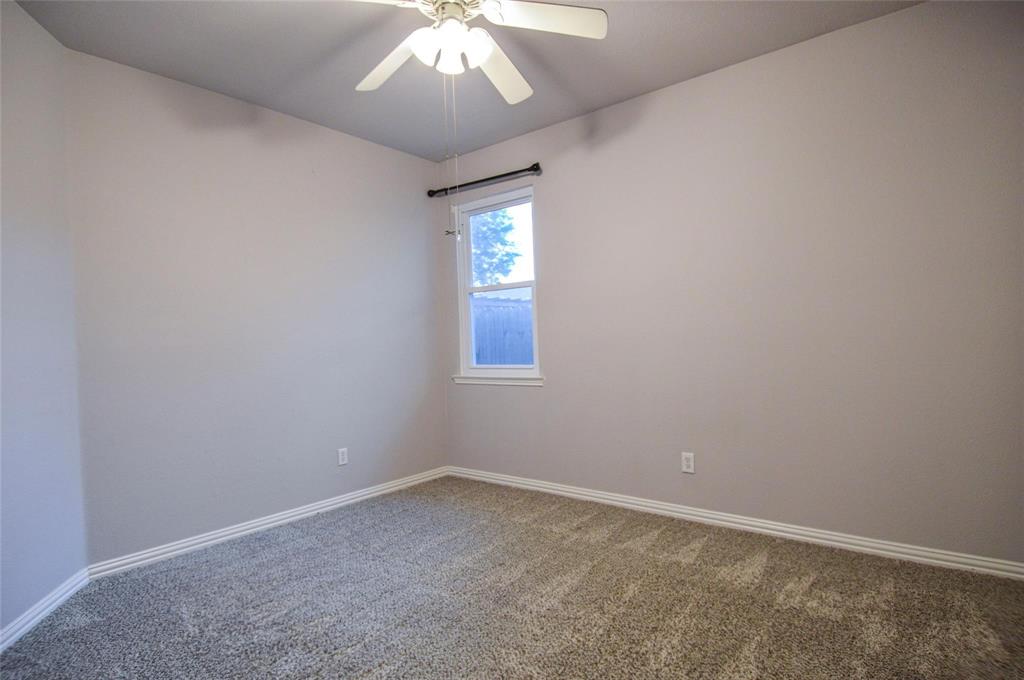 1305 Pine Ridge Road Roanoke, TX 76262 - Photo 9 of 13 an empty room with a chandelier fan