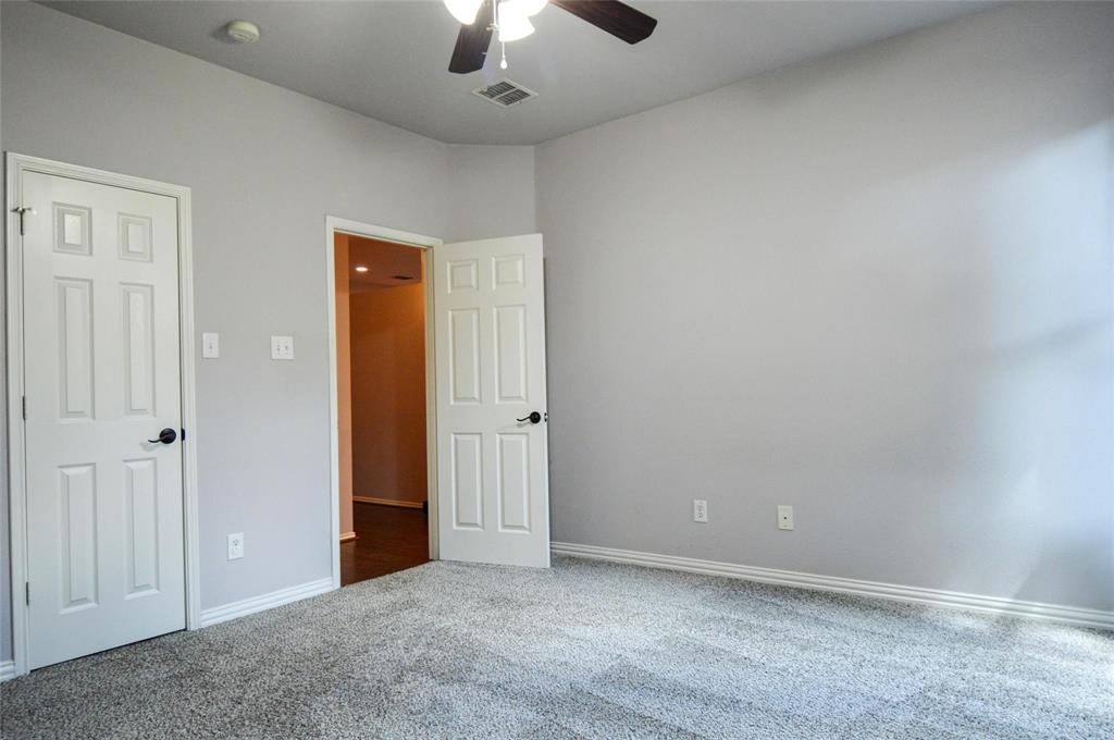 1305 Pine Ridge Road Roanoke, TX 76262 - Photo 10 of 13 an empty room with chandelier fan