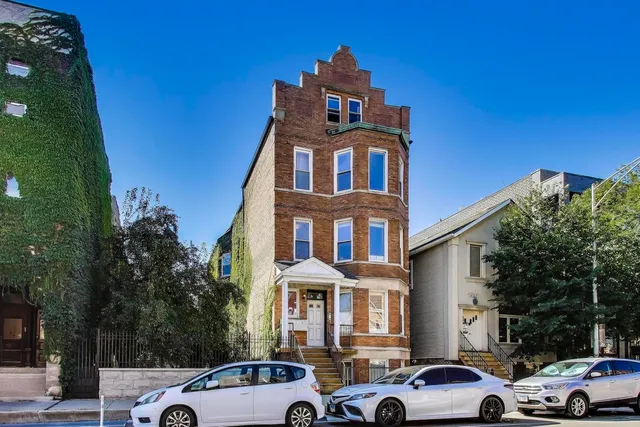 a front view of a building with parking space