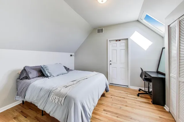 a bedroom with a bed and a table in it