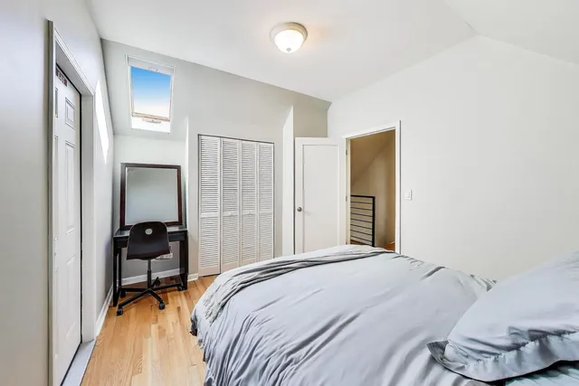 a bedroom with a bed and a view of bathroom
