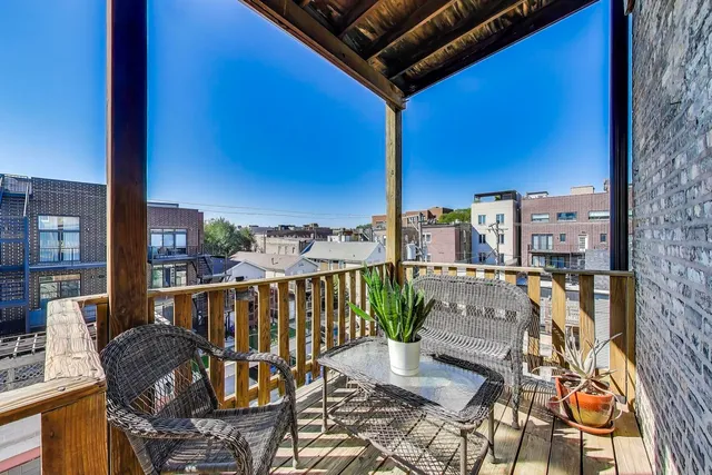 a view of balcony with furniture