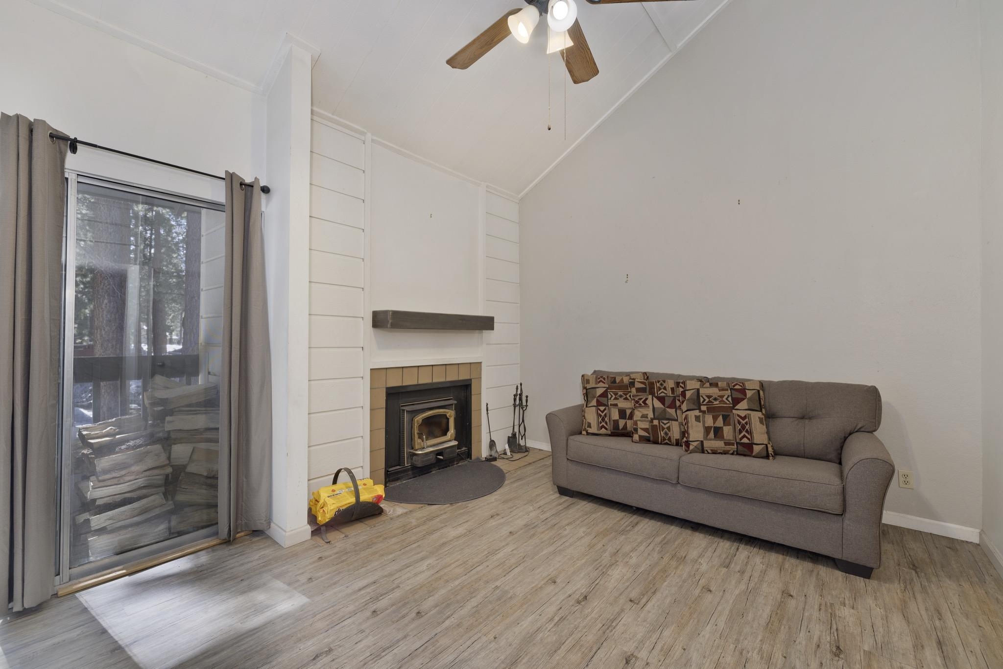 2289 Sierra Nevada Road, Unit G10 Mammoth Lakes, CA 93546 - Photo 9 of 23 Living room featuring a ceiling fan, lofted ceiling, and light wood-style floors