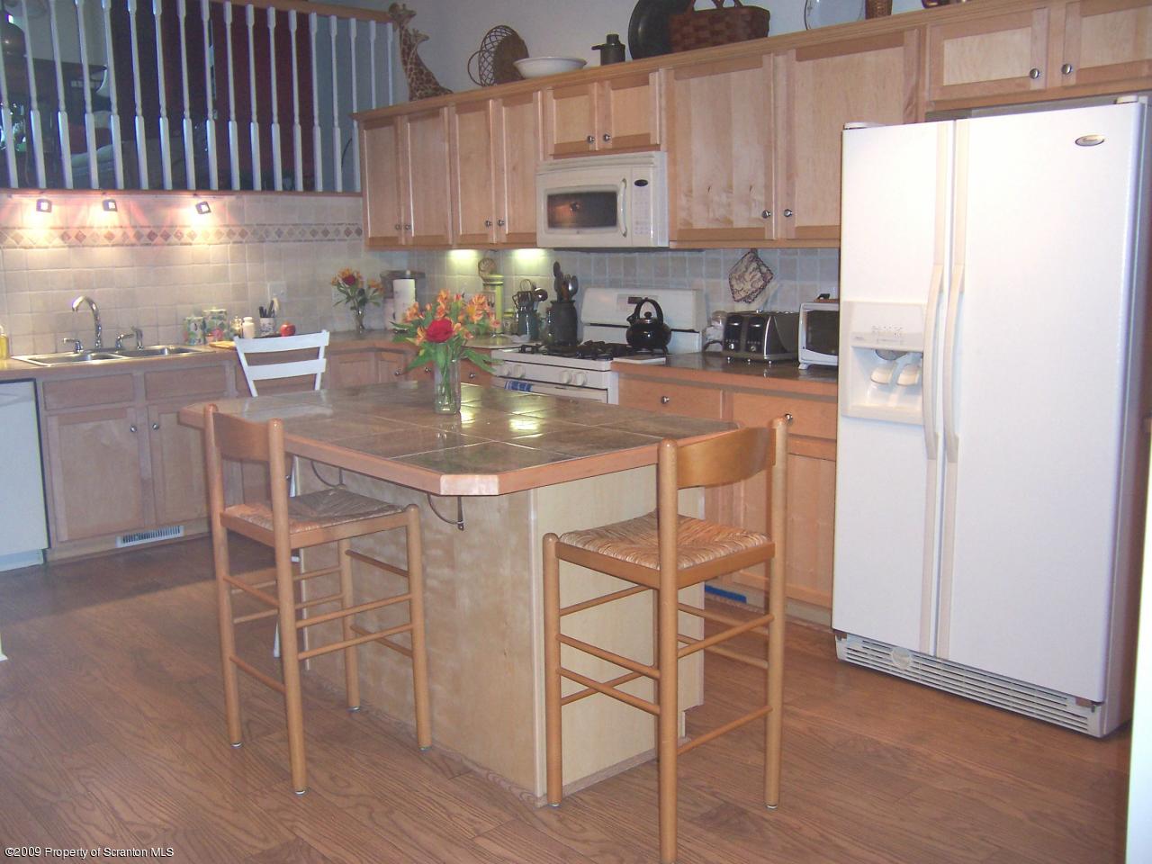701 Green Ridge Street Scranton, PA 18509 - Photo 4 of 10 a kitchen with stainless steel appliances granite countertop a refrigerator and a stove top oven
