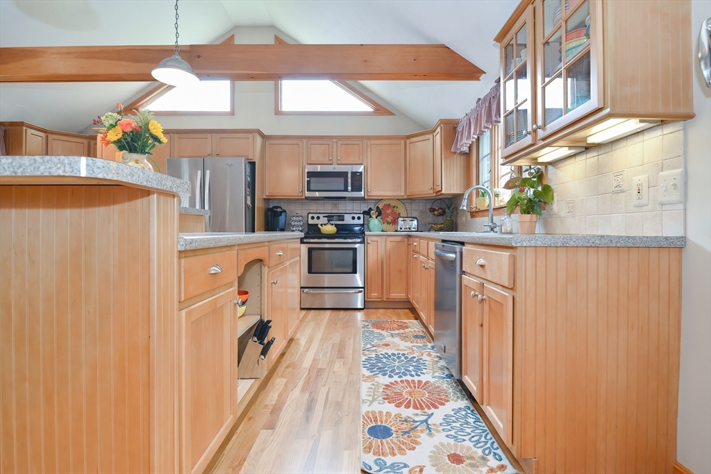 143 South Meadow Road Plymouth, MA 02360 - Photo 11 of 35 a kitchen with stainless steel appliances granite countertop a sink and a refrigerator