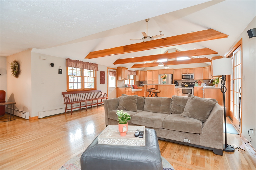 143 South Meadow Road Plymouth, MA 02360 - Photo 16 of 35 a living room with furniture and a wooden floor