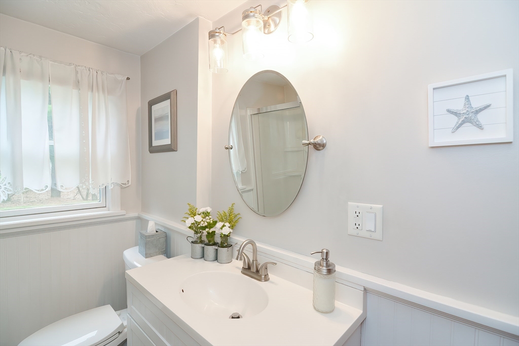 143 South Meadow Road Plymouth, MA 02360 - Photo 17 of 35 a bathroom with a sink toilet and a mirror
