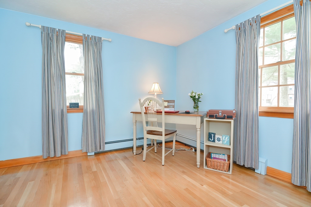 143 South Meadow Road Plymouth, MA 02360 - Photo 21 of 35 a dining room with a window and wooden floor