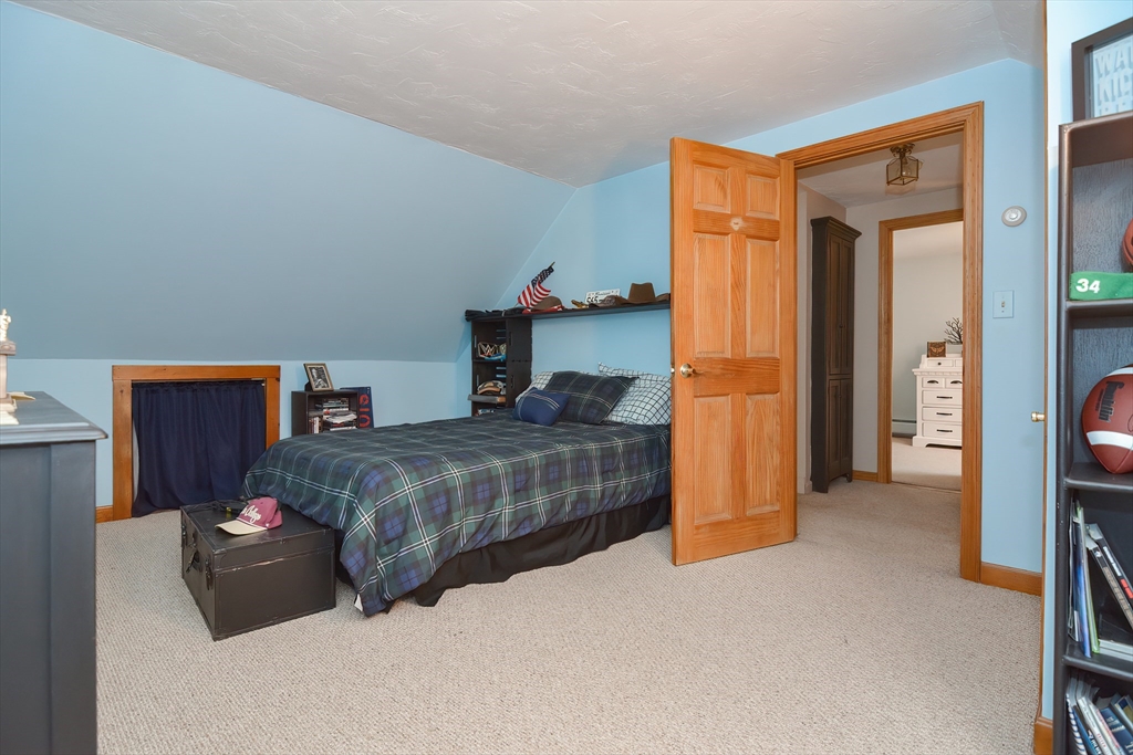 143 South Meadow Road Plymouth, MA 02360 - Photo 23 of 35 a bedroom with a bed and a tv