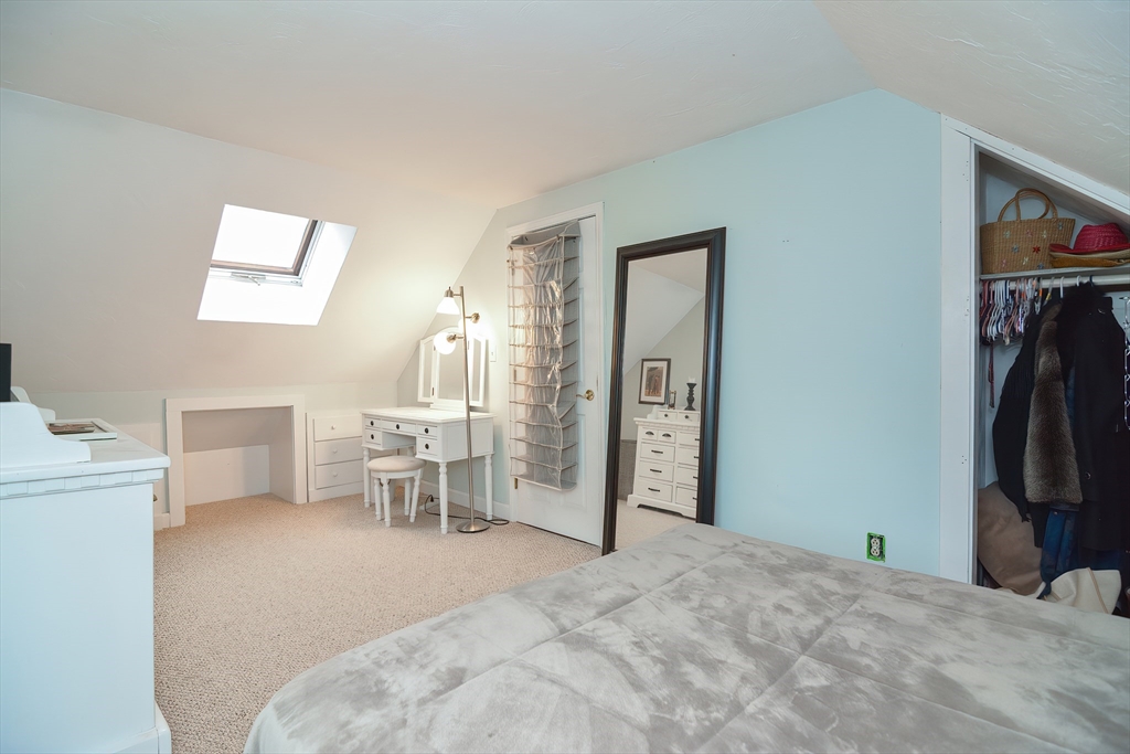 143 South Meadow Road Plymouth, MA 02360 - Photo 24 of 35 a bedroom with a bed and a chair
