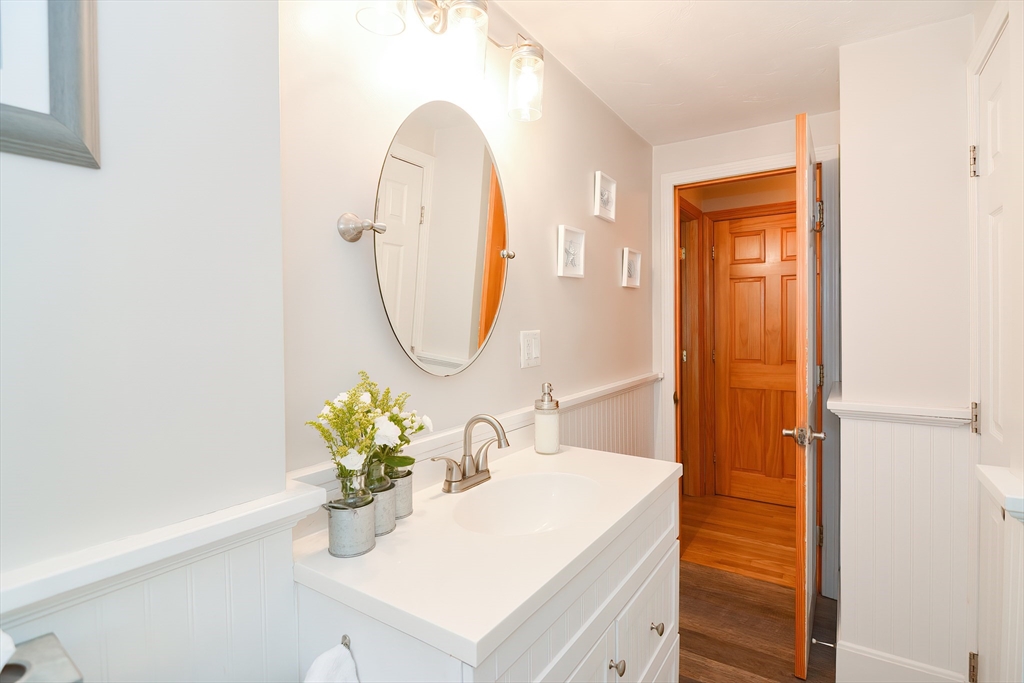 143 South Meadow Road Plymouth, MA 02360 - Photo 26 of 35 a bathroom with a sink a vanity and a mirror