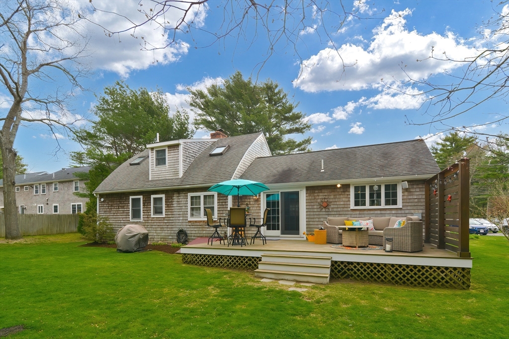 143 South Meadow Road Plymouth, MA 02360 - Photo 6 of 35 a front view of a house with a yard table and chairs