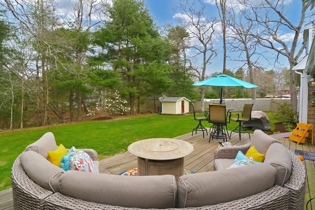 143 South Meadow Road Plymouth, MA 02360 - Photo 7 of 35 a view of a patio with furniture and a garden