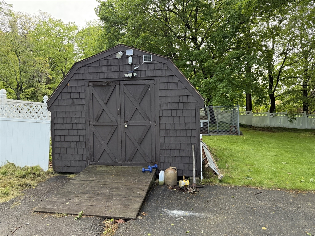 0 Grove Street Worcester, MA 01609 - Photo 7 of 9 a front view of a house with garden