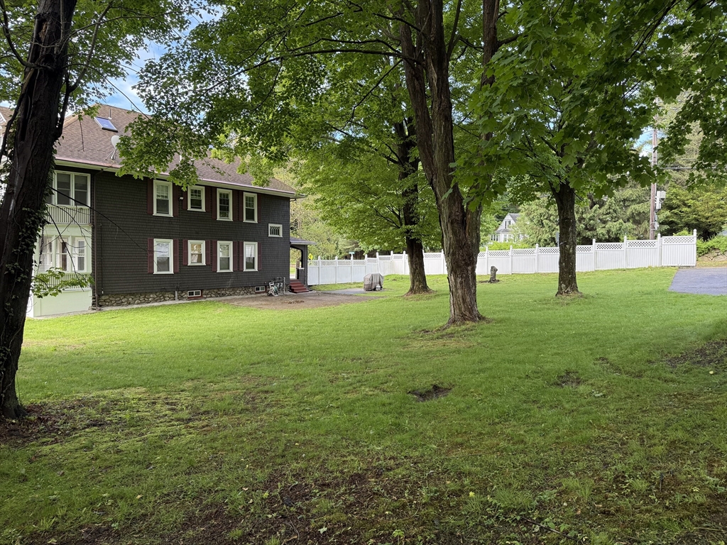 0 Grove Street Worcester, MA 01609 - Photo 8 of 9 a view of a yard with a house and large trees