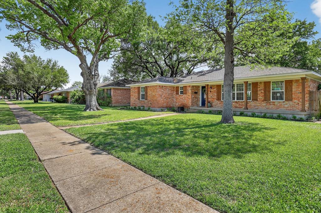 2920 Sharpview Lane Dallas, TX 75228 - Photo 2 of 34 Ranch-style house with brick siding and a front yard