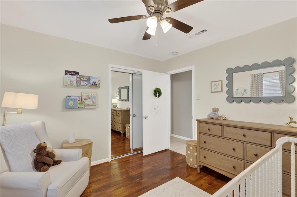 2920 Sharpview Lane Dallas, TX 75228 - Photo 23 of 34 Bedroom with a nursery area, dark wood-style floors, a closet, and ceiling fan