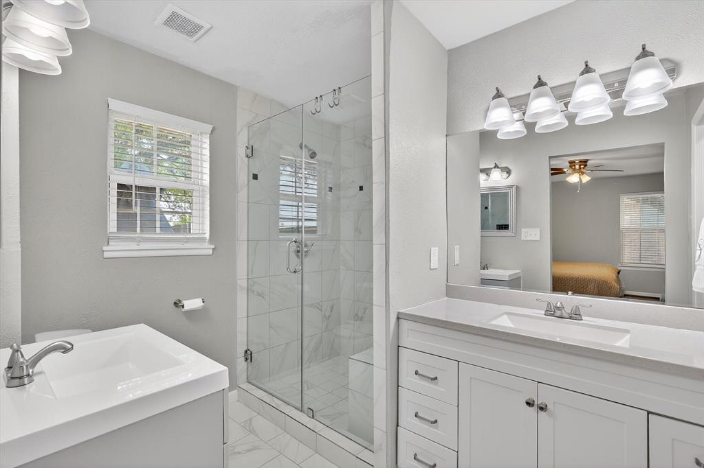 2920 Sharpview Lane Dallas, TX 75228 - Photo 26 of 34 Bathroom with vanity, a shower stall, ensuite bathroom, and a ceiling fan