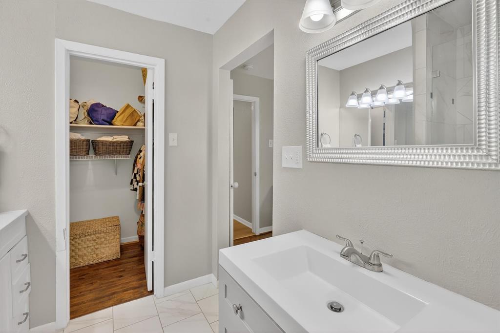 2920 Sharpview Lane Dallas, TX 75228 - Photo 28 of 34 Primary Bathroom with vanity & a spacious secondary closet