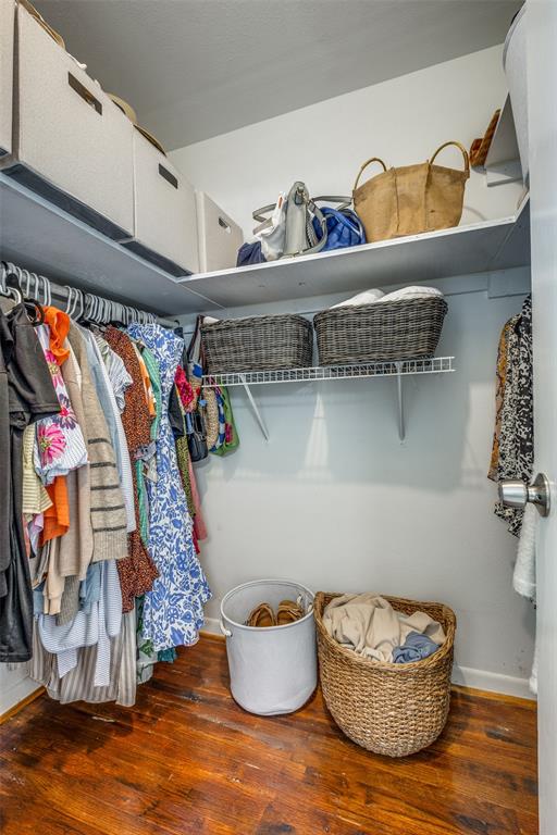 2920 Sharpview Lane Dallas, TX 75228 - Photo 29 of 34 Walk in closet featuring dark wood finished floors