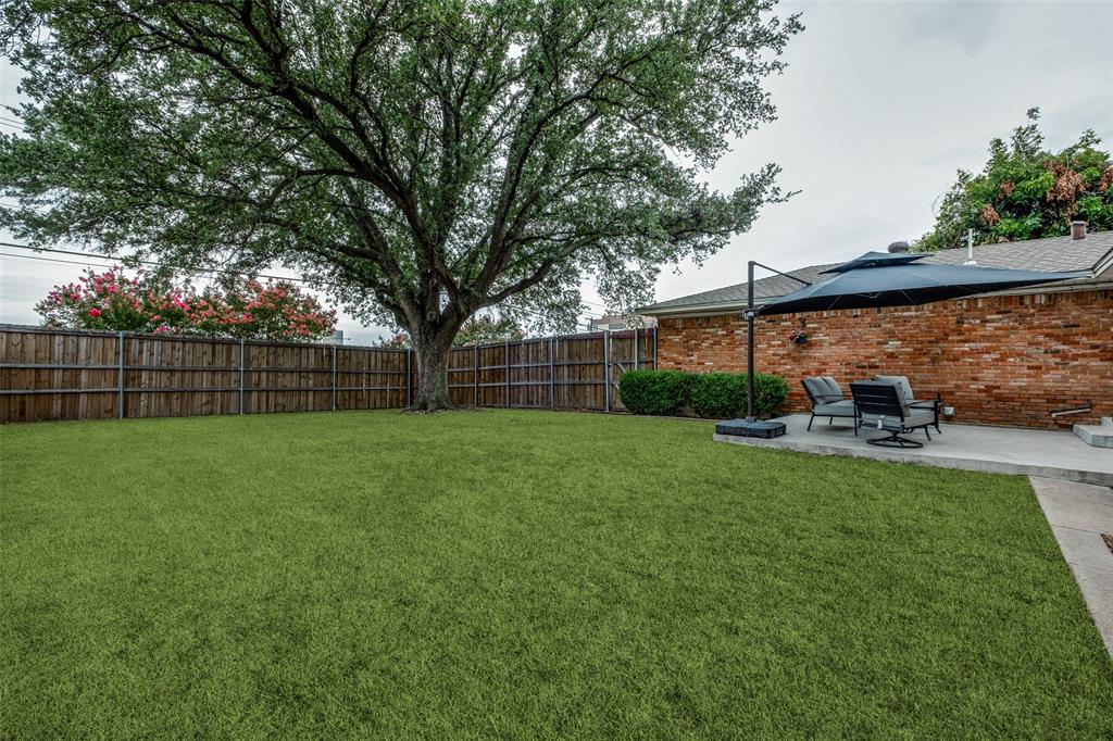2920 Sharpview Lane Dallas, TX 75228 - Photo 32 of 34 Fenced backyard with a patio area