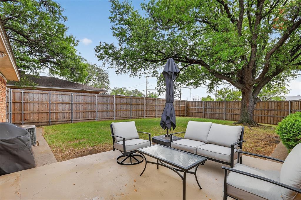 2920 Sharpview Lane Dallas, TX 75228 - Photo 34 of 34 Fenced backyard with an outdoor living space, a patio area, and area for grilling