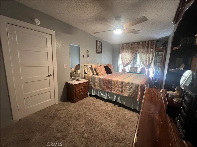 a bedroom with bed and window