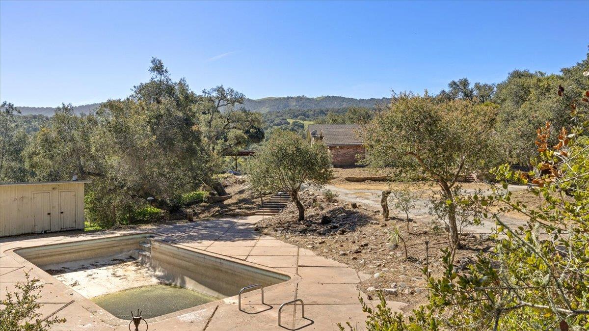 379 Corral De Tierra Road Salinas, CA 93908 - Photo 2 of 47 a view of a backyard with wooden fence